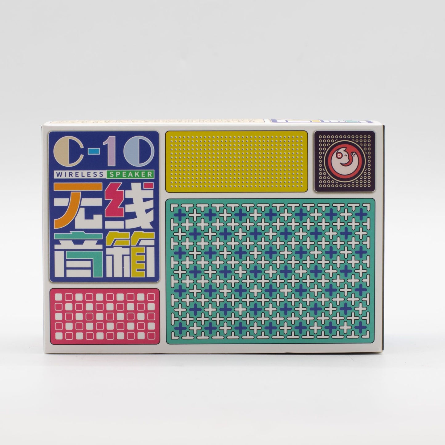 Caja rectangular blanca de altavoz Bluetooth Jojocut C10 con diseño retro, gráficos coloridos y patrones geométricos.