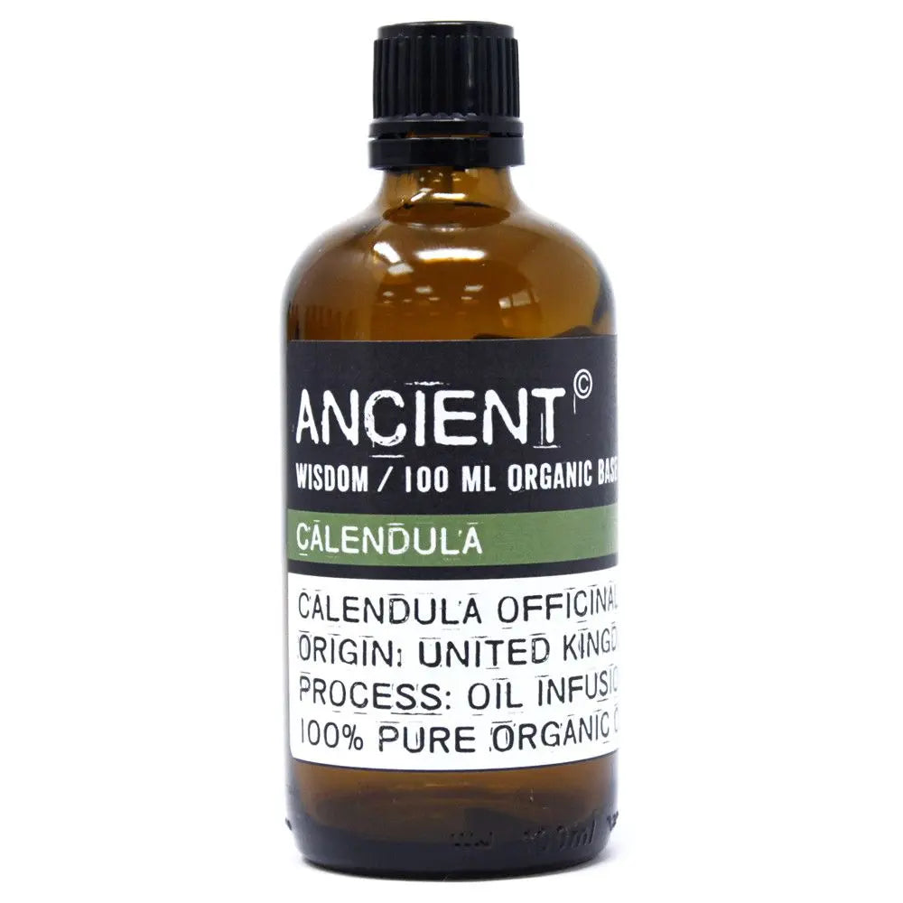 Frasco de vidrio ámbar de 100ml con tapón negro y etiqueta informativa sobre aceite orgánico de caléndula en fondo blanco