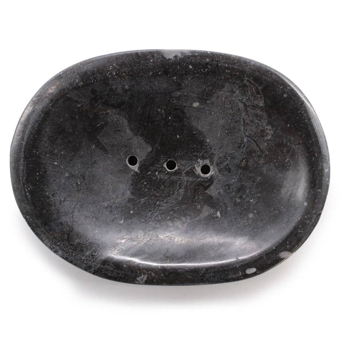 Jabonera ovalada de mármol negro natural con acabado pulido y tres orificios de drenaje. Diseño clásico y elegante.