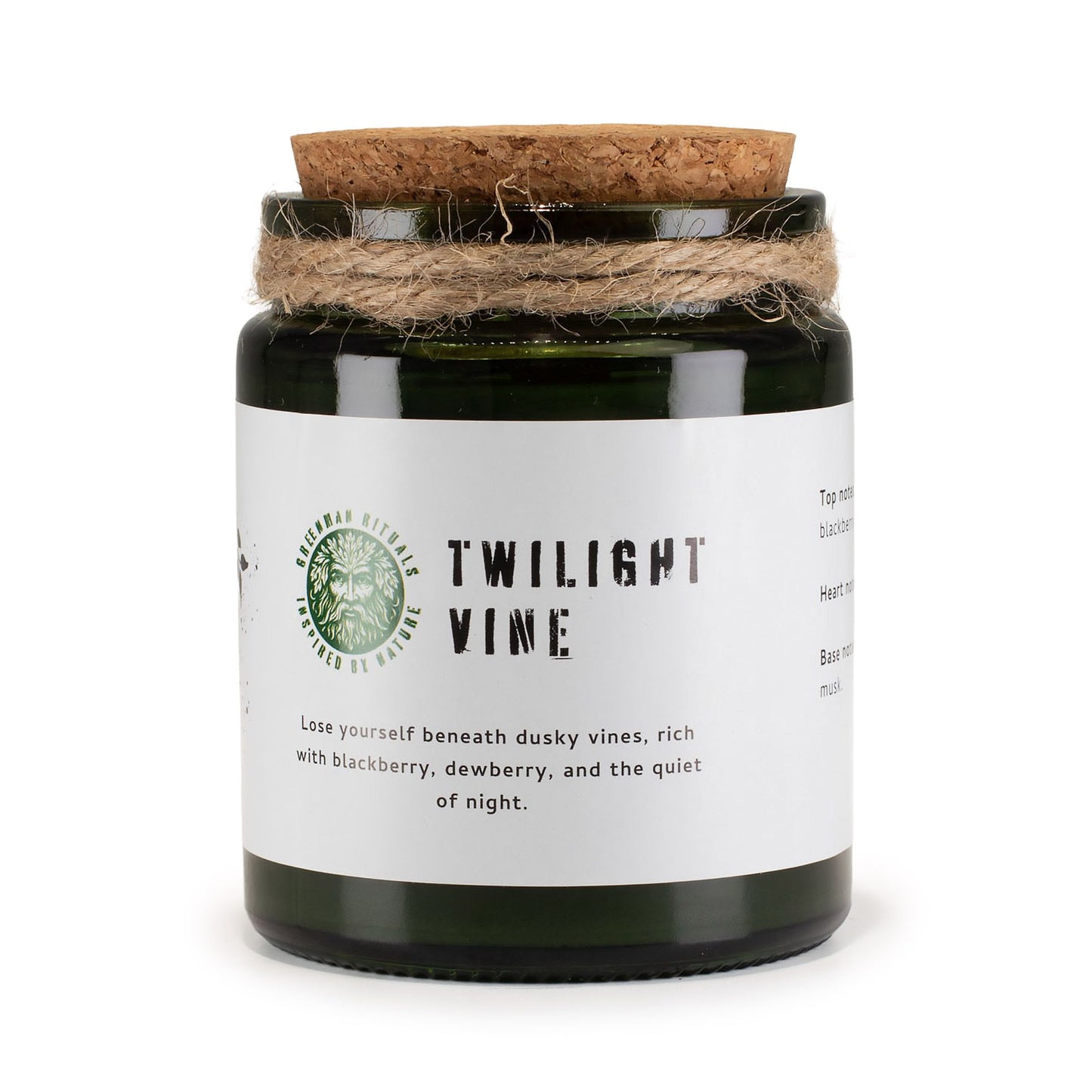 Vela en frasco verde, tapa de corcho, aroma a moras y flor de saúco, estilo rústico y elegante.
