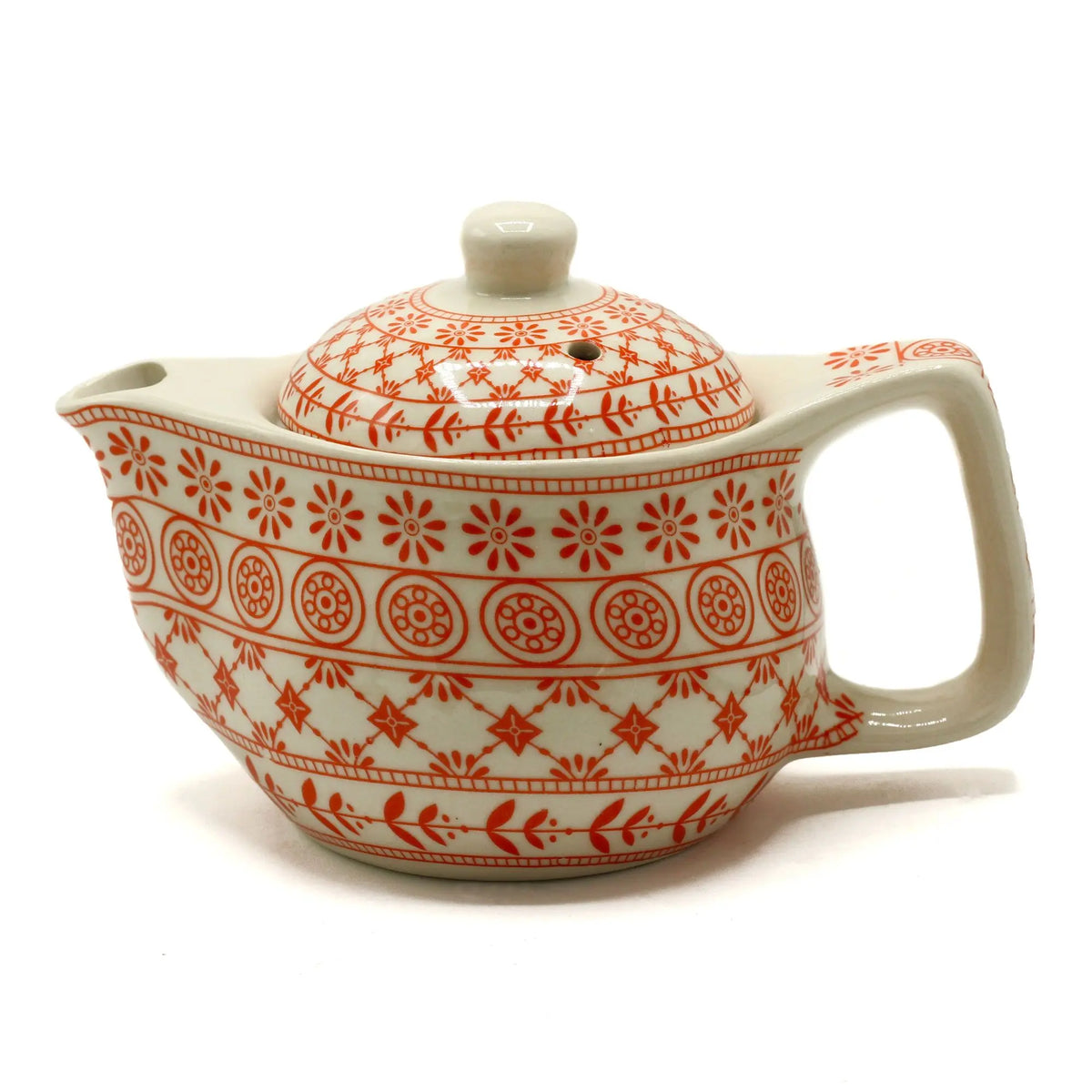 Tetera de cerámica 350ml con patrón floral y geométrico en tono ámbar sobre fondo color crema.