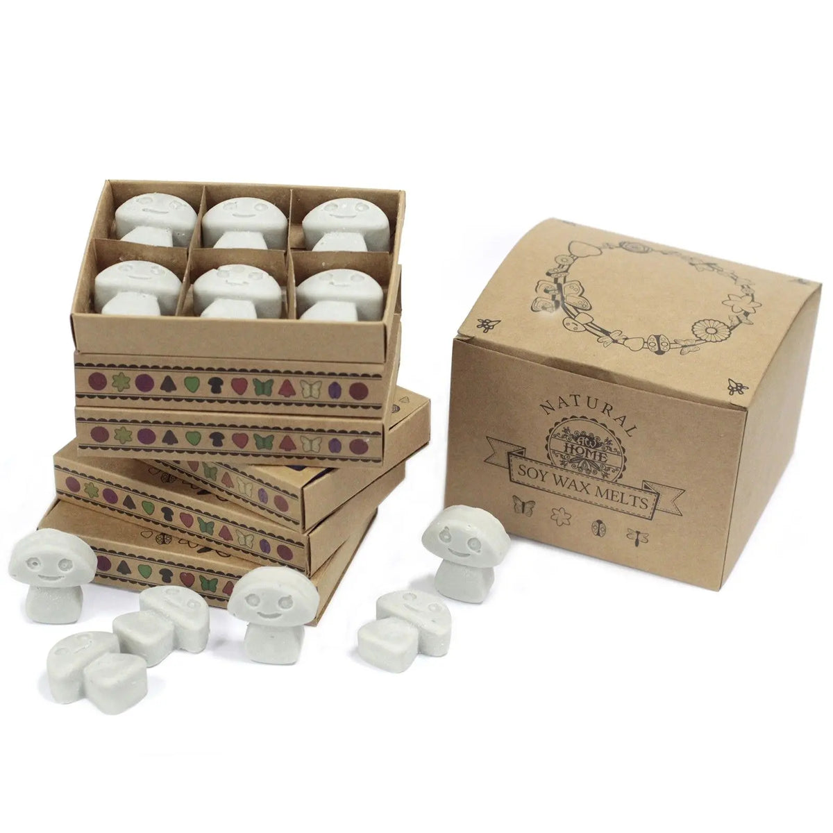 Cajas de cartón kraft con 6 ceras de soja gris claro en forma de setas sonrientes con detalles decorativos.