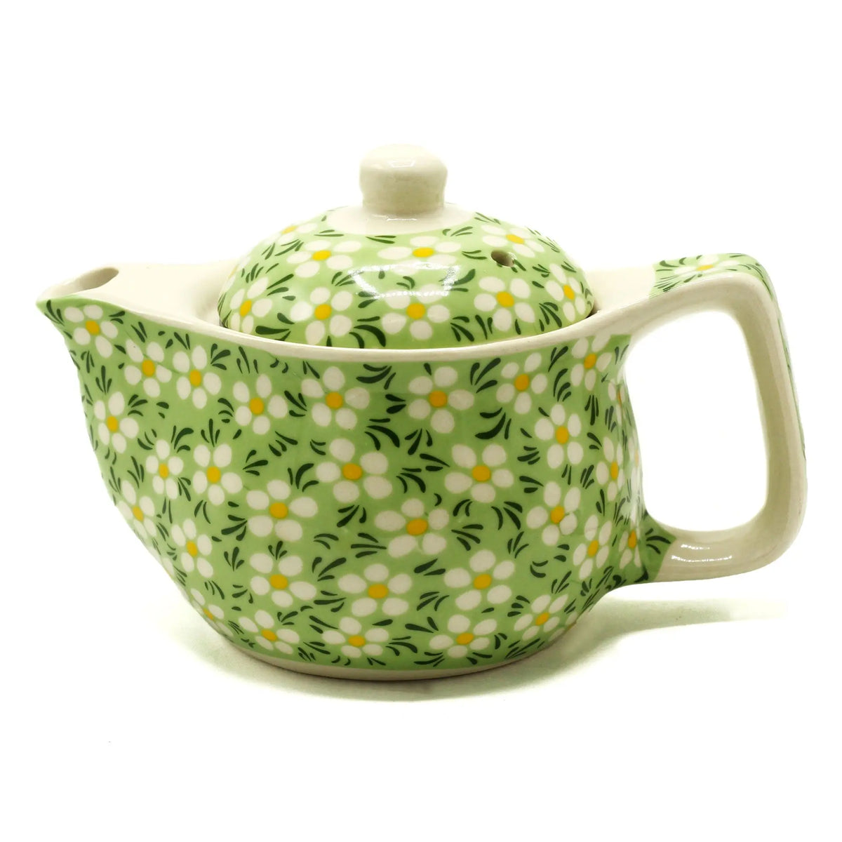 Tetera de cerámica pequeña con estampado de margaritas blancas sobre fondo verde y tapa a juego. Capacidad 350ml.