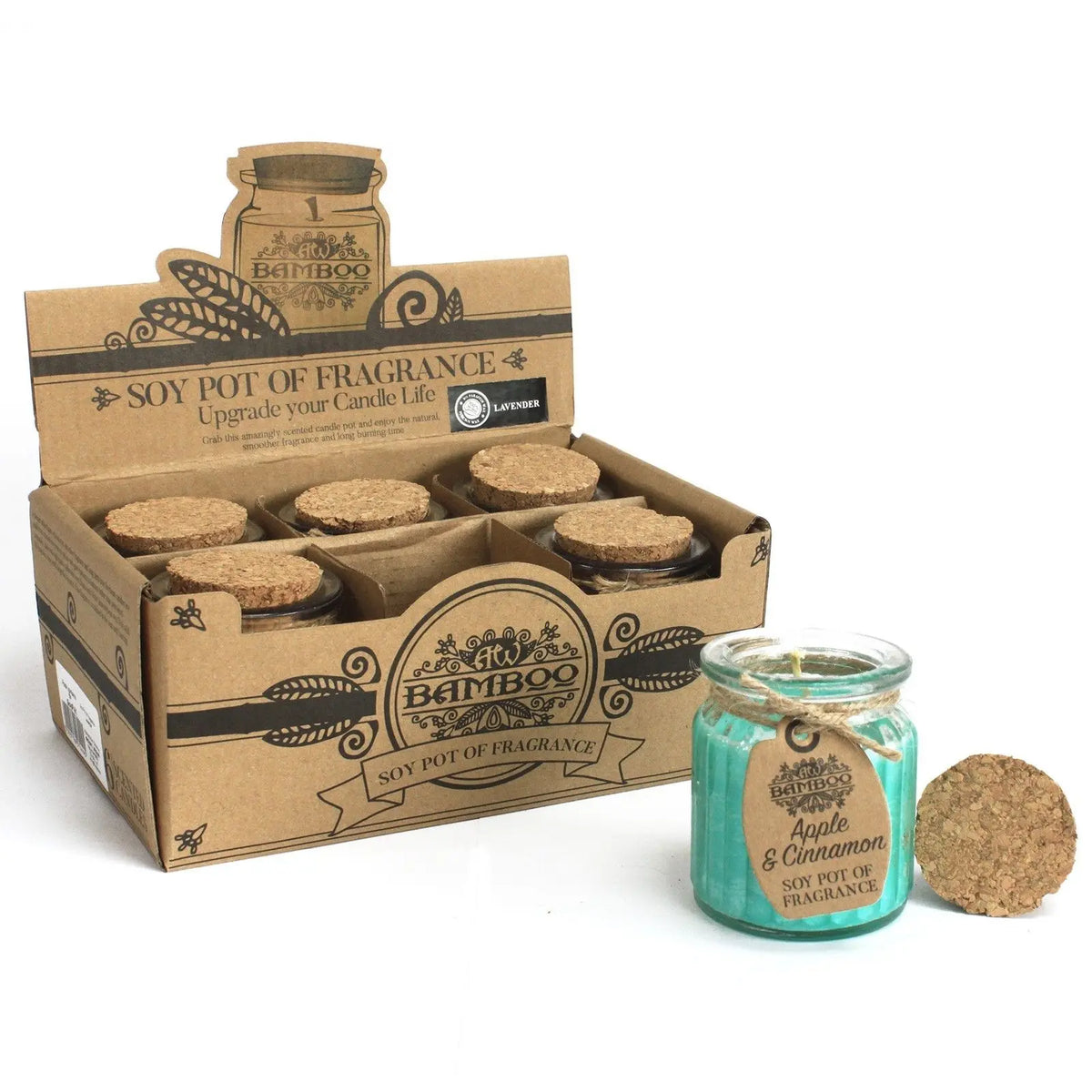 Caja de cartón con velas de cera de soja azul en tarros de vidrio con tapa de corcho, aroma manzana y canela.
