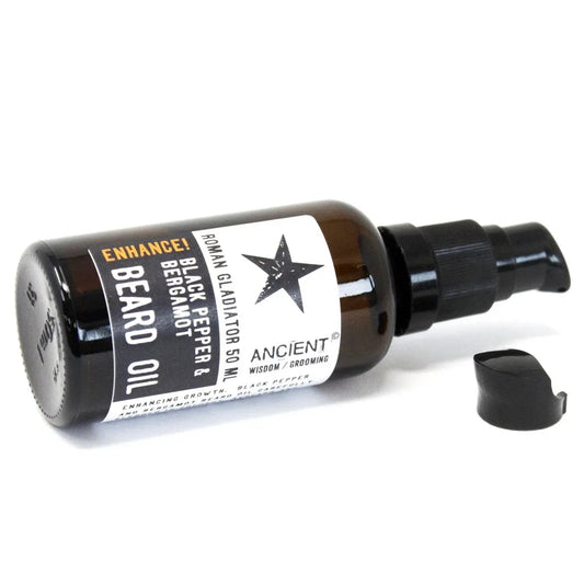 Frasco de vidrio ámbar de 50ml con dosificador negro y etiqueta blanca de aceite para barba Ancient Wisdom.