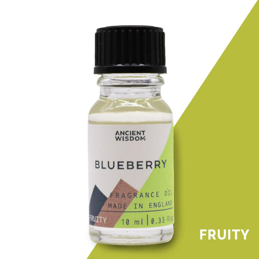 Frasco pequeño de vidrio transparente con aceite aromático de arándano, tapón negro y etiqueta geométrica de 10 ml.