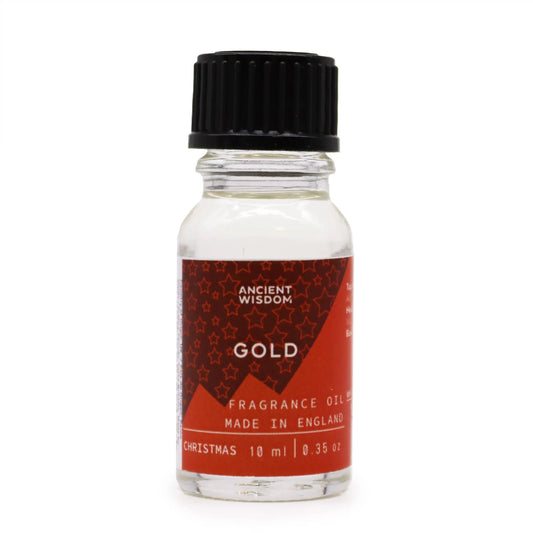 Frasco de vidrio de 10ml con tapa negra y etiqueta roja con estrellas, conteniendo aceite de fragancia aroma Oro.