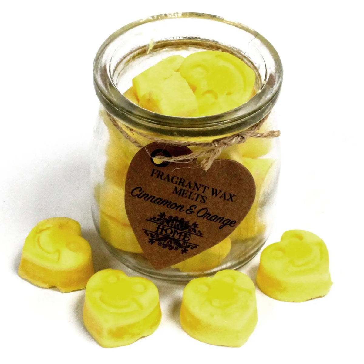 Frasco de vidrio con pastillas de cera de soja amarillas con forma de corazón y carita sonriente, aroma canela y naranja.