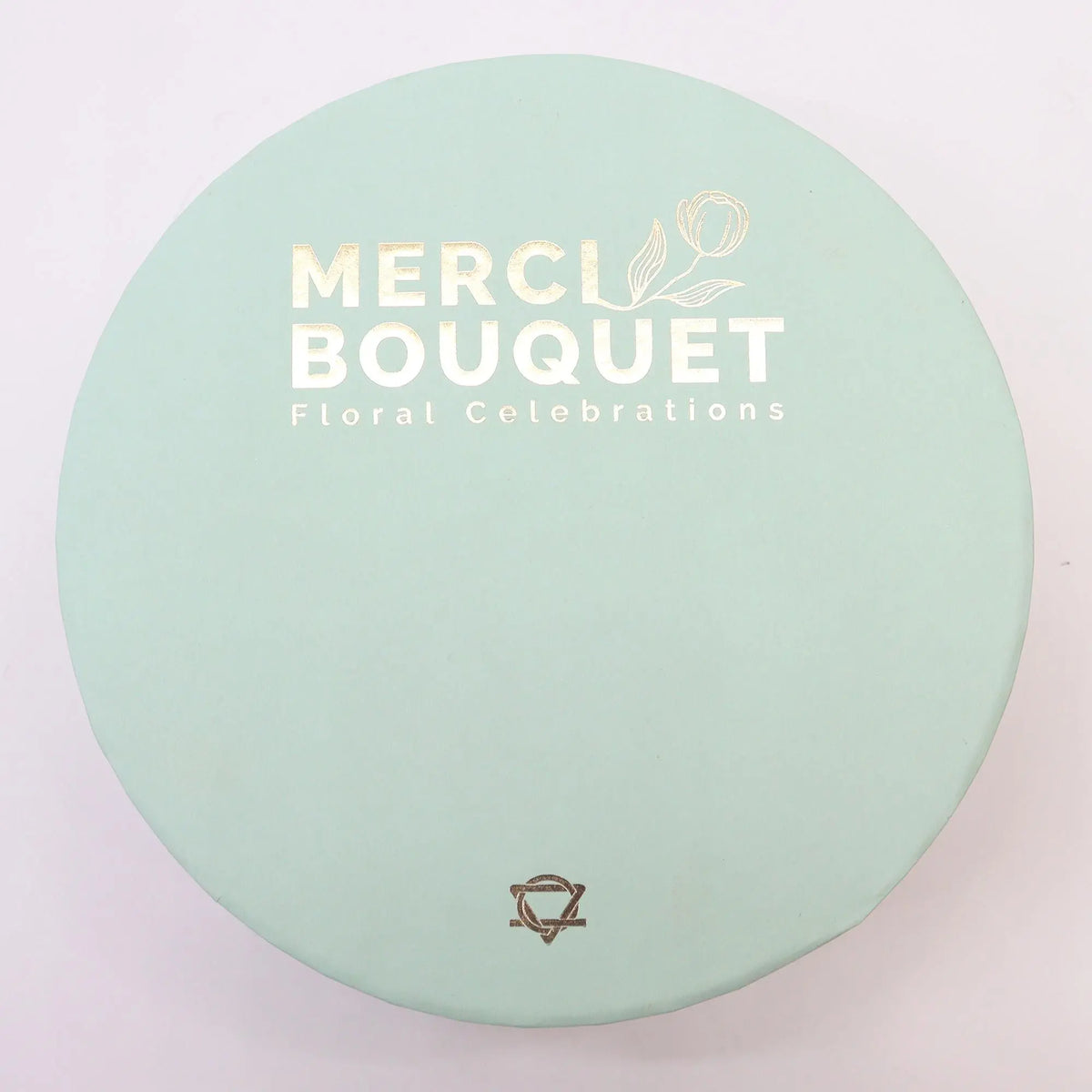 Caja de regalo redonda color verde menta con acabado mate y elegante diseño minimalista para flores