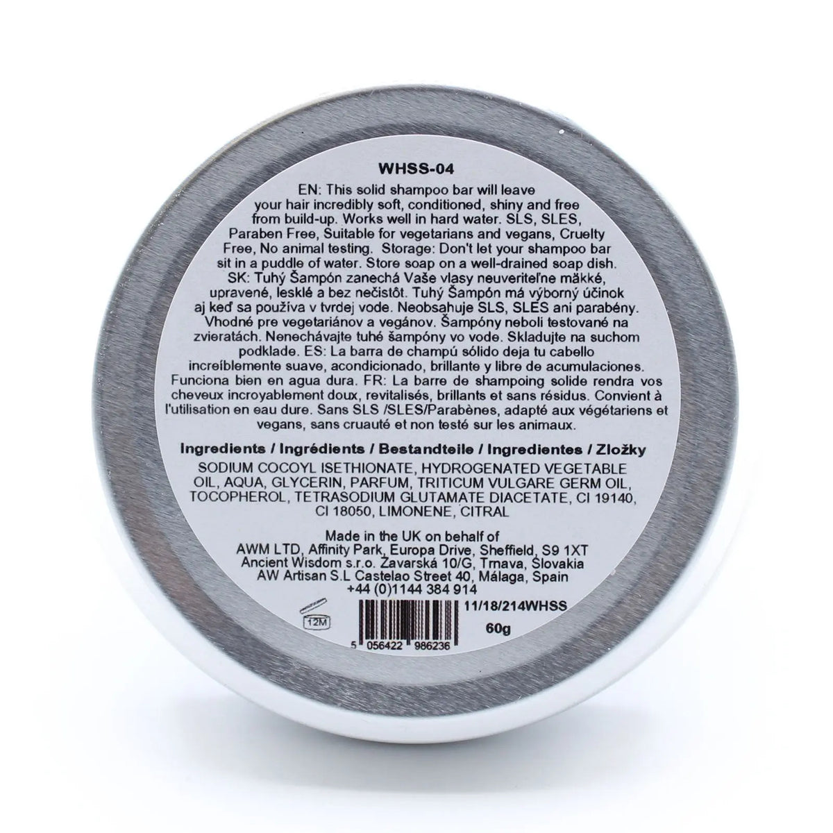 Vista trasera de lata metálica redonda con etiqueta blanca y texto informativo sobre ingredientes en varios idiomas.