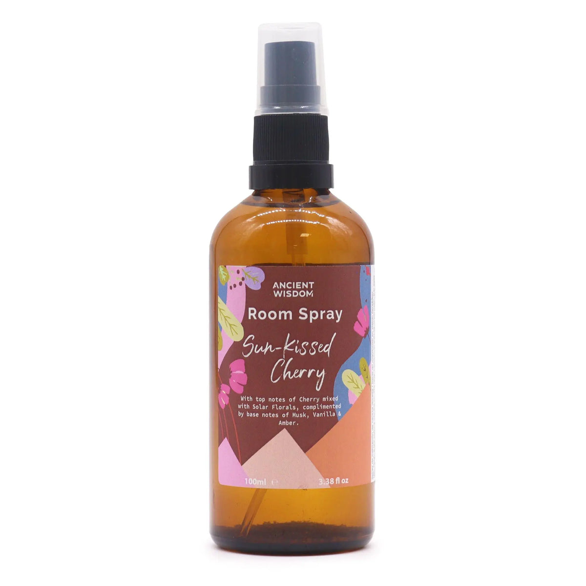 Ambientador en spray de 100ml en botella de vidrio ámbar con etiqueta colorida de motivos florales sobre fondo blanco.