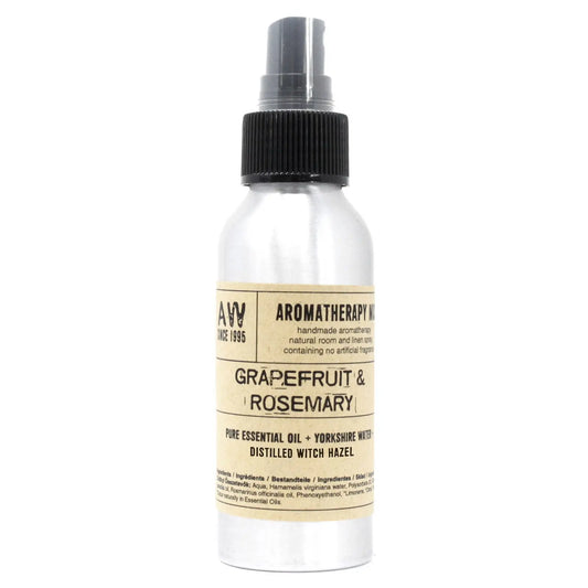 Botella de aluminio de 100ml con spray negro y etiqueta beige, producto de aromaterapia de pomelo y romero.