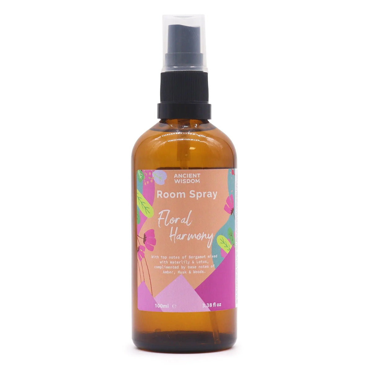 Spray ambientador de 100ml en botella de vidrio ámbar con atomizador negro y etiqueta floral colorida.