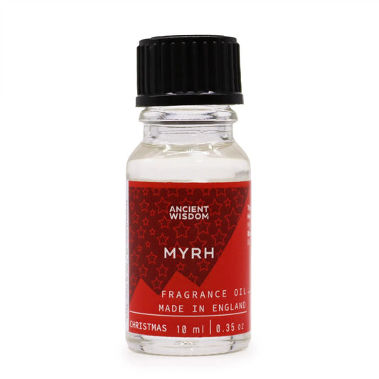 Frasco de vidrio de 10ml con tapa negra y etiqueta roja con estrellas blancas, rotulado como aceite de fragancia Mirra.