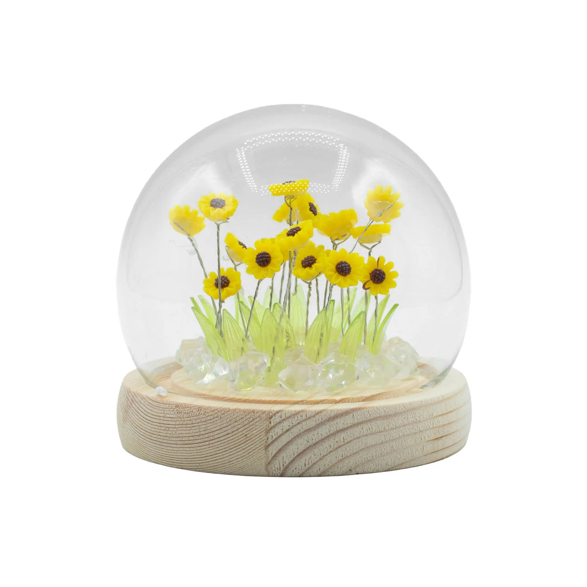 Domo de cristal con 20 girasoles amarillos, hojas verdes y luces LED sobre base de madera circular. Marca Ancient Wisdom.
