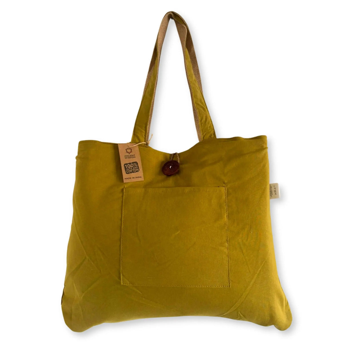 Bolsa grande reversible color pistacho de yute y algodón con asas, bolsillo frontal y cierre de botón de madera.