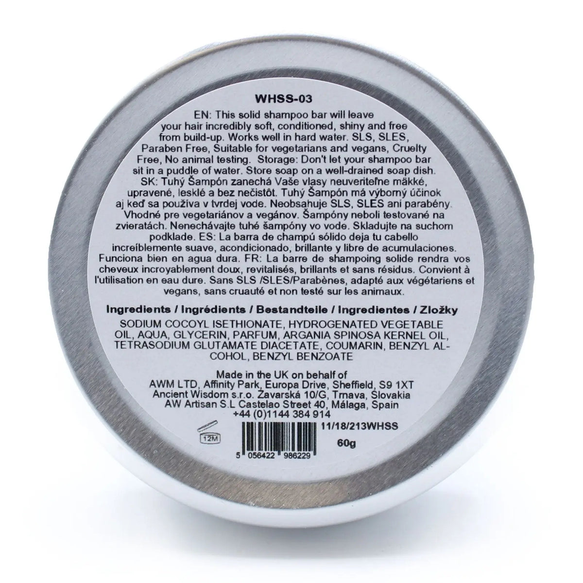 Base de lata circular con etiqueta informativa multilingüe sobre champú sólido Wild Hare de 60g de Ancient Wisdom.