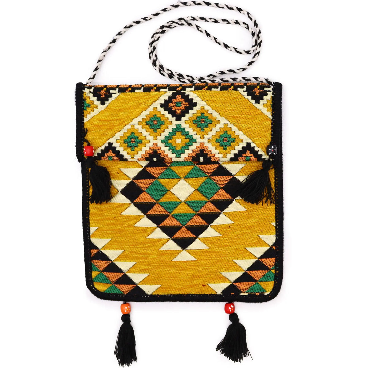 Bolso bandolera de kilim amarillo con patrón geométrico, borlas negras y correa de cuerda trenzada en blanco y negro.