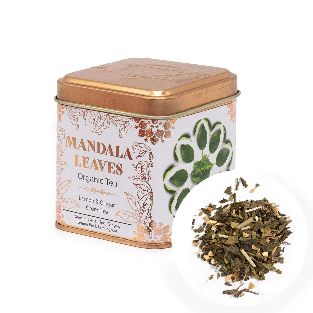 Lata cuadrada color cobre con té orgánico de limón y jengibre, junto a una muestra de hebras secas sobre fondo blanco.