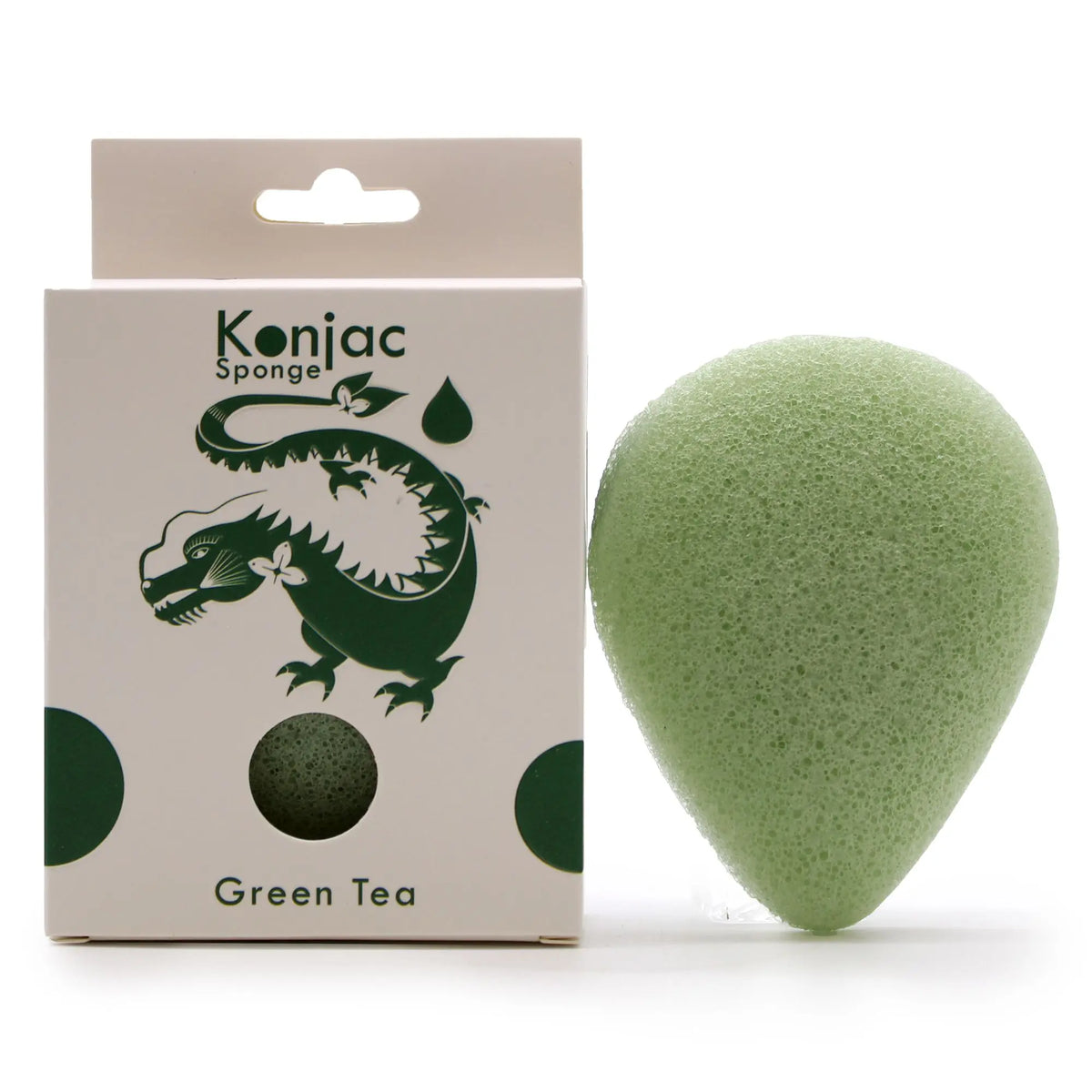 Esponja facial konjac de color verde, con forma de gota, junto a su caja de cartón con ilustración de un dragón.
