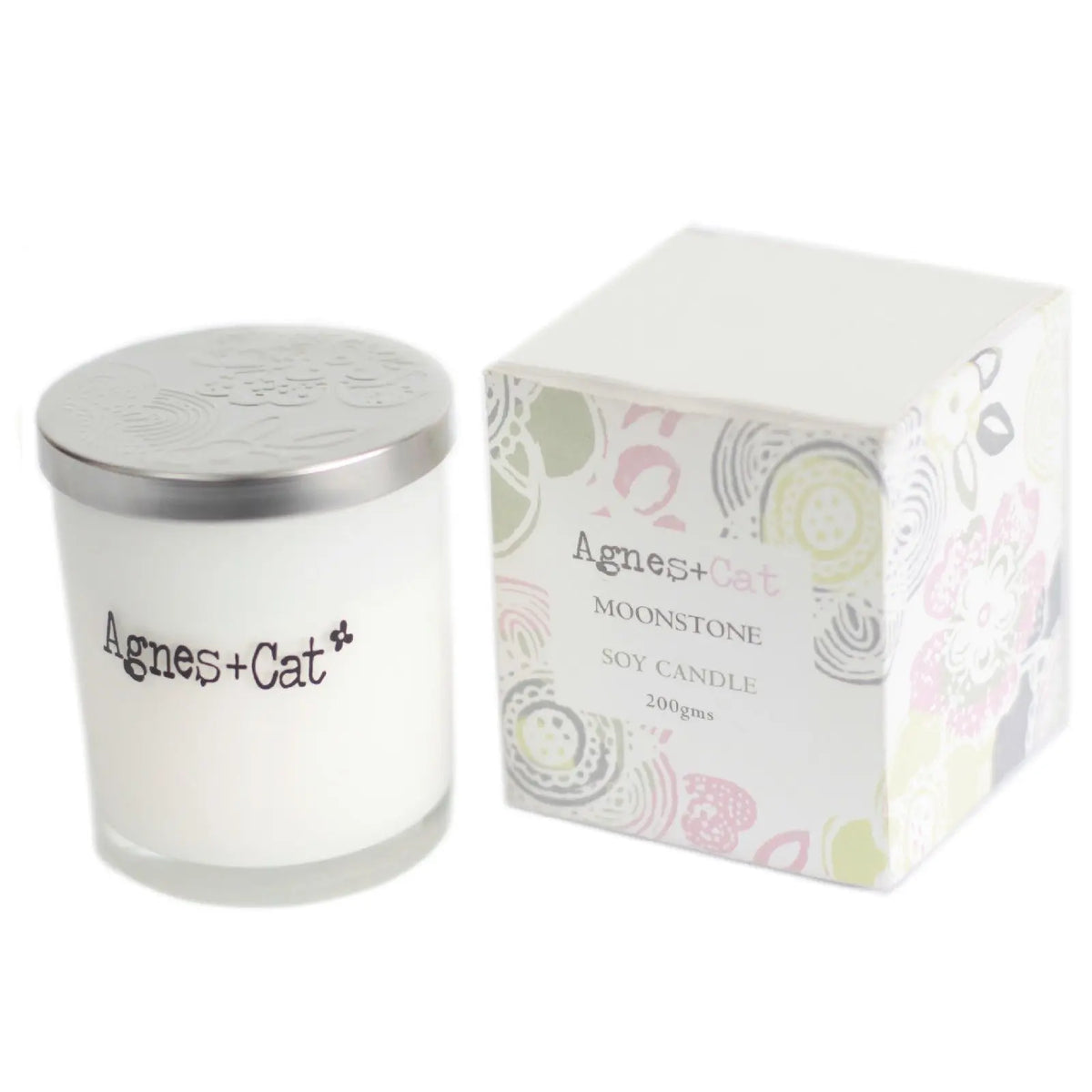 Vela de soja Moonstone de 200g en frasco de vidrio blanco con tapa plateada y caja decorativa de colores suaves.