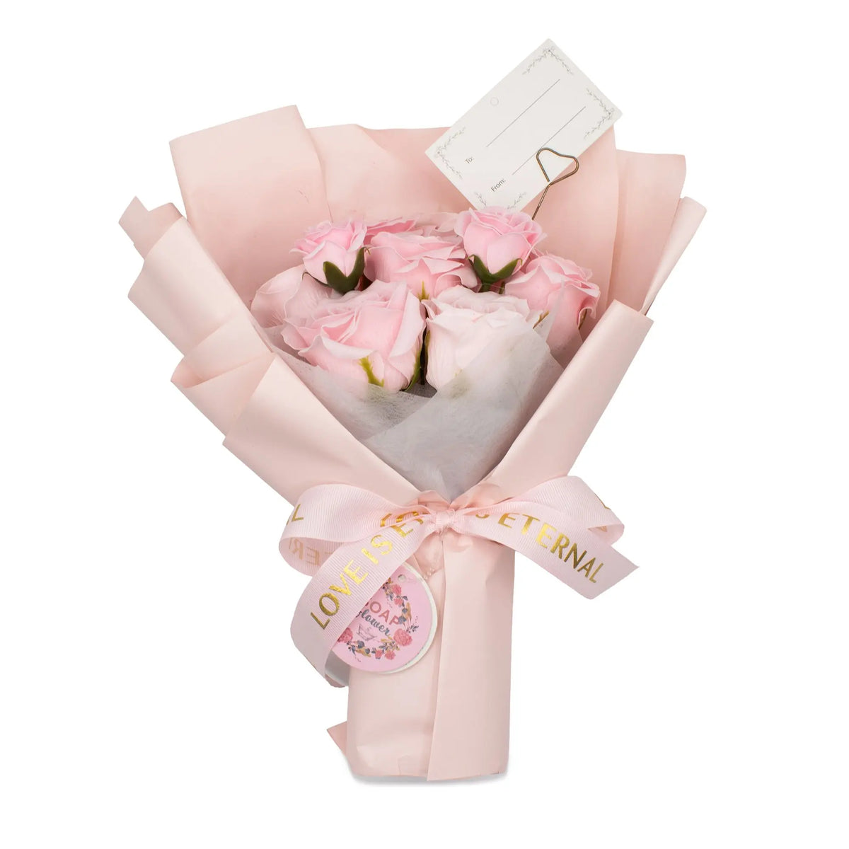 Ramo de rosas rosas con papel suave en tono pastel y cinta decorativa, ideal para regalar en ocasiones especiales.