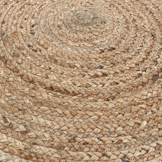 Alfombra redonda de yute natural y algodón reciclado con textura trenzada de estilo artesanal en tonos beige cálidos
