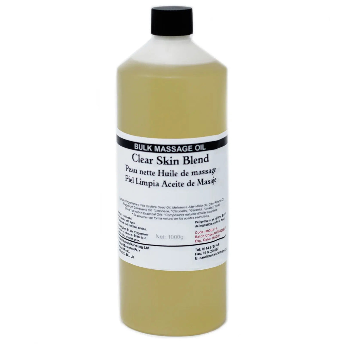 Botella cilíndrica de plástico con 1kg de aceite de masaje amarillento, tapón negro y etiqueta con texto informativo.