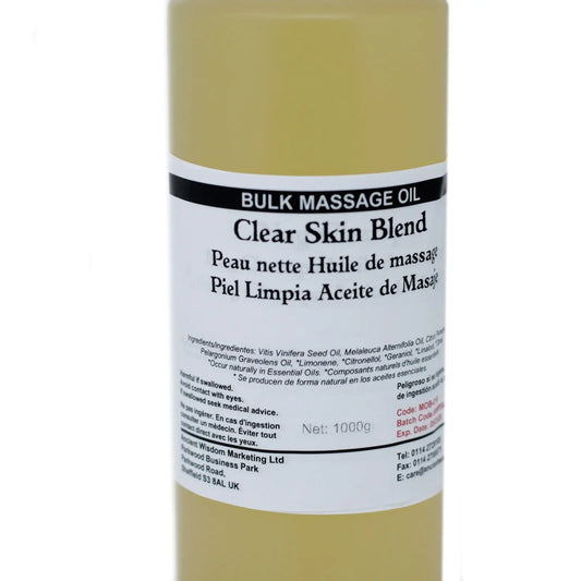 Botella cilíndrica de 1kg con aceite de masaje amarillo traslúcido y etiqueta blanca con texto informativo.