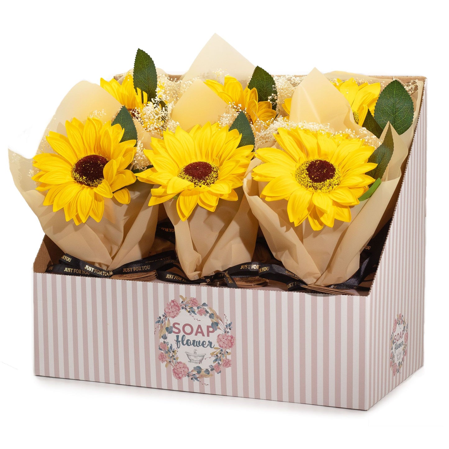 Exhibidor con ramos individuales de girasoles hechos de jabón, envueltos en papel craft con detalles decorativos.