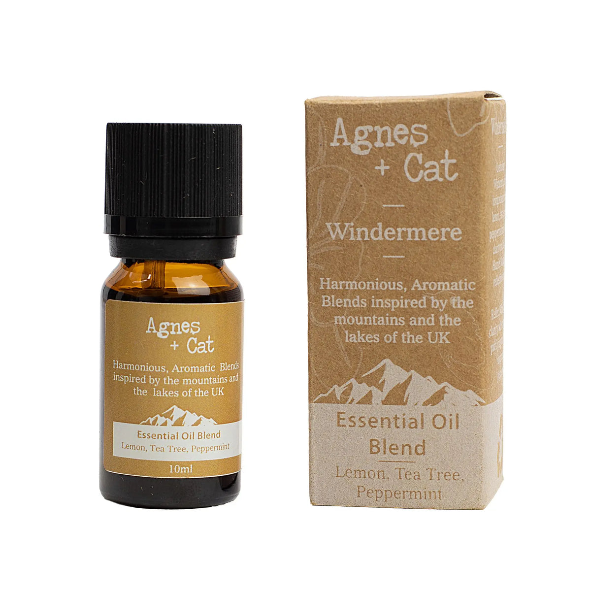 Frasco de aceite esencial Windermere y caja de cartón reciclado con diseño de montaña y texto de marca Agnes + Cat.