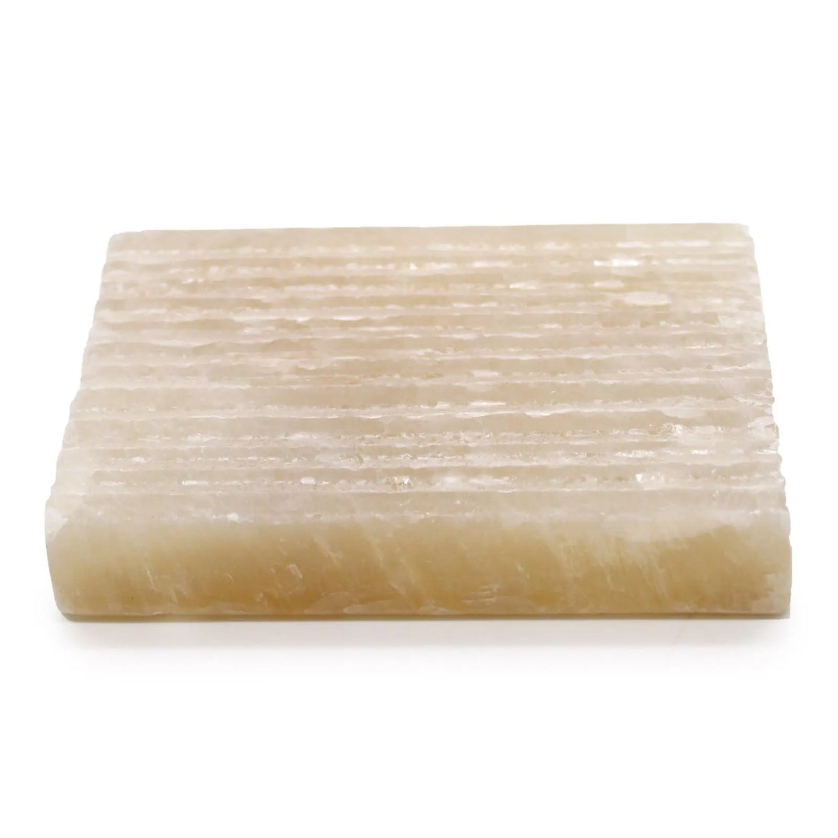 Jabonera cuadrada de piedra natural Honey Onyx, color beige traslúcido con superficie estriada sobre fondo blanco.