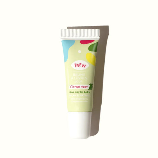 Lime day lip balm in a light green squeezable tube with colorful abstract shapes and Trew branding.