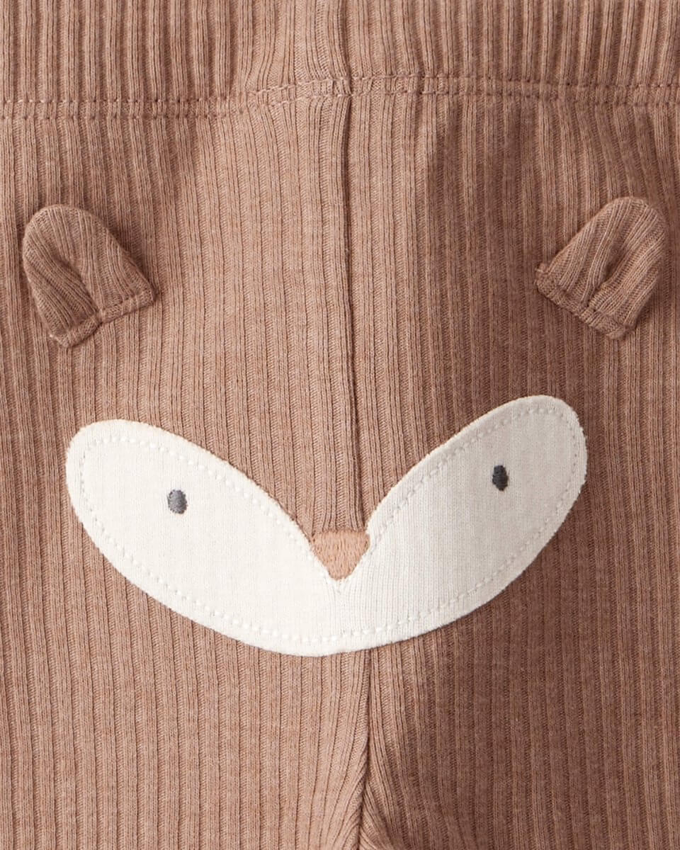 Conjunto dos piezas marrón con dos bodys y pantalón