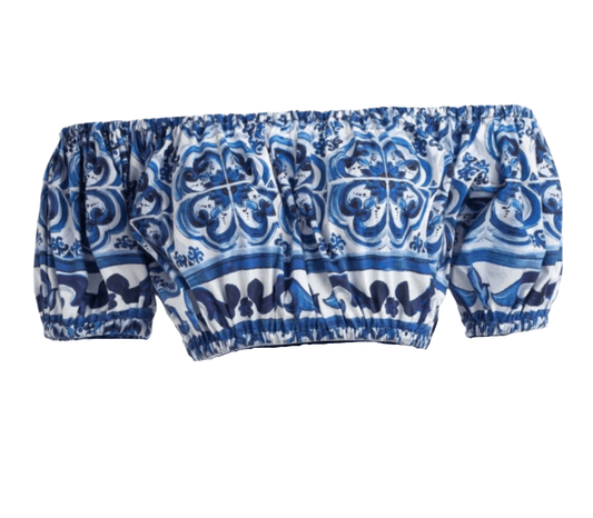 Off-the-shoulder cotton top with blue and white Italian-style porcelain majolica tile print and elastic trim.