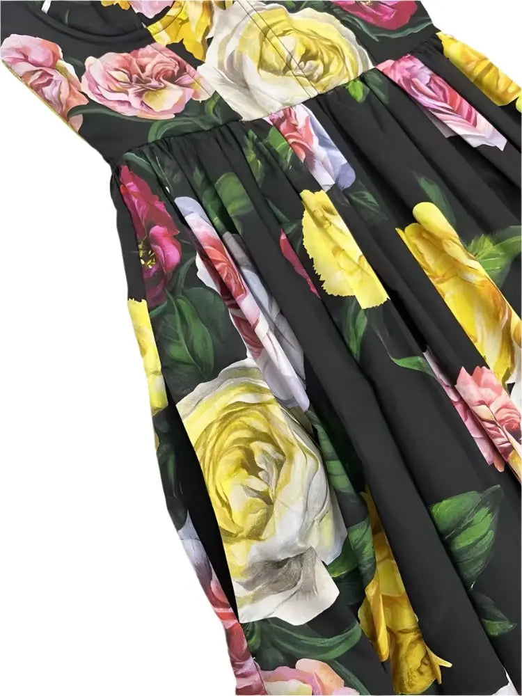 Floral cotton dress featuring vibrant yellow, pink, and white roses on a dark background, perfect for summer outings.