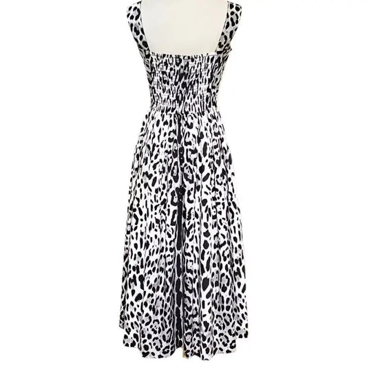 Black and white leopard print sundress with smocked bodice and flowy skirt, perfect for summer outings.