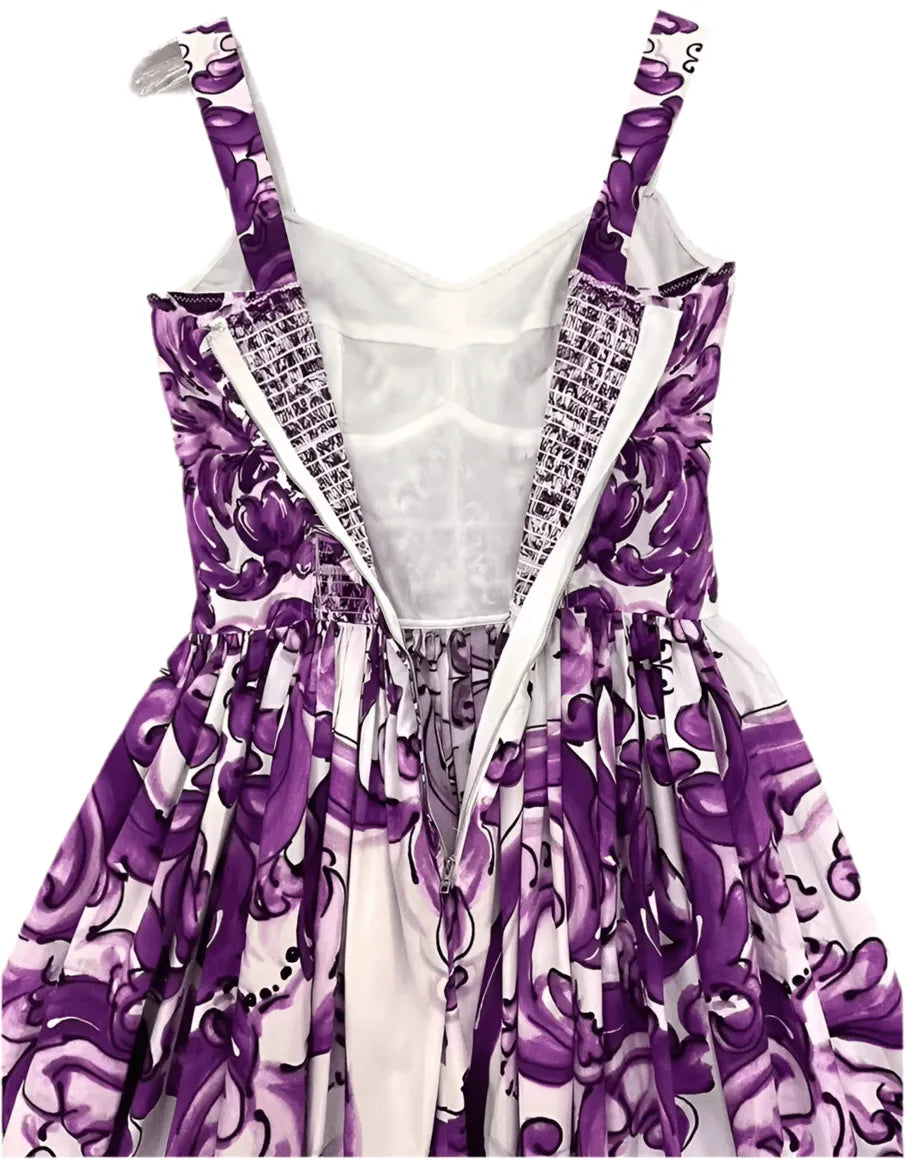 Purple floral print sundress with adjustable straps and gathered waist, perfect for summer outings.