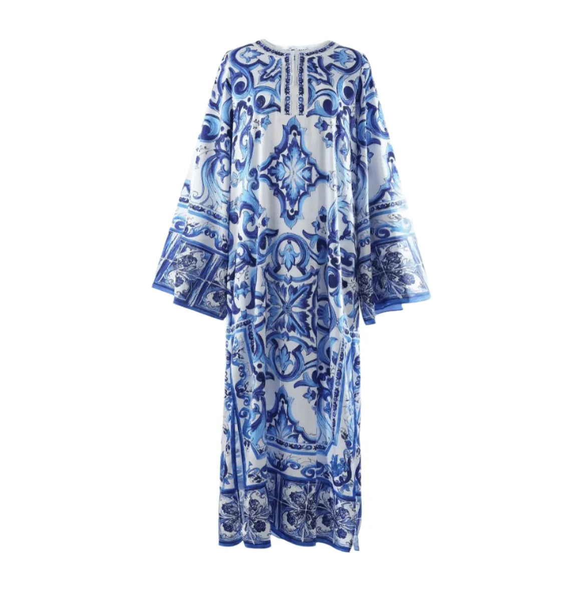 Blue and white patterned maxi dress with long sleeves and intricate tile designs, perfect for warm-weather occasions.