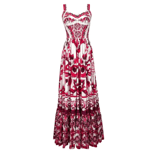 Red and white floral maxi dress with delicate straps and ruffled hem, made from lightweight, breathable fabric.