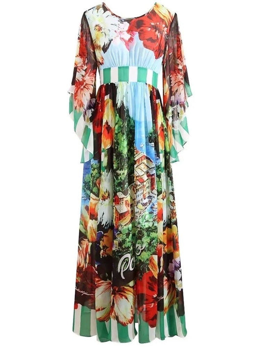 Floral maxi dress with green striped hem, featuring vibrant colors and sheer ruffled sleeves. Perfect for summer occasions.