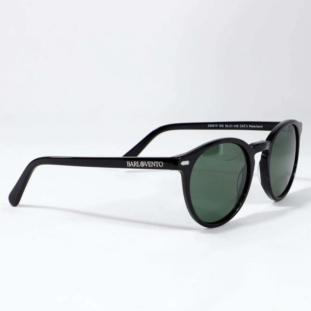Gafas de sol unisex con montura redonda de pasta negra brillante y lentes polarizadas verdes estilo clásico.