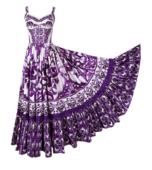 Purple floral maxi dress with a bohemian style, featuring a fitted bodice and flowing skirt, ideal for summer.