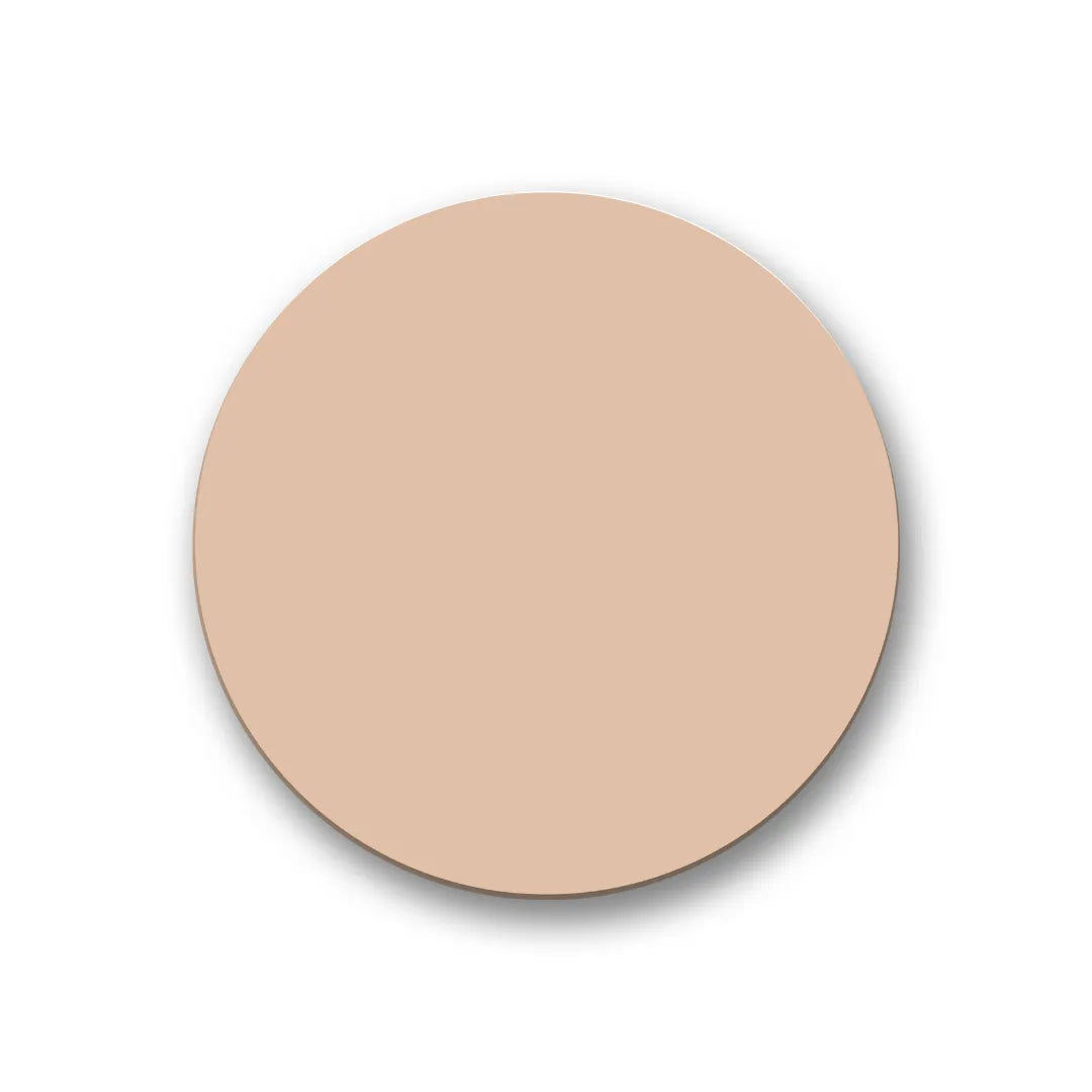 A smooth, circular swatch of light beige cream foundation on a white background.