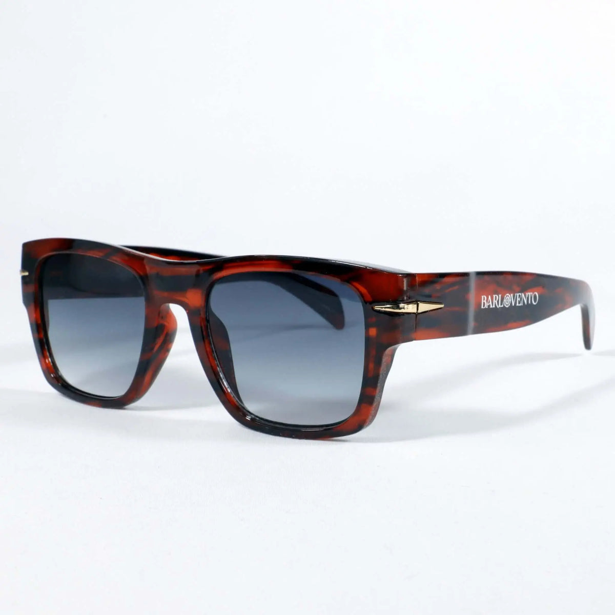 Gafas de sol unisex con montura de carey, forma rectangular y lentes azules con protección UV400 sobre fondo blanco.