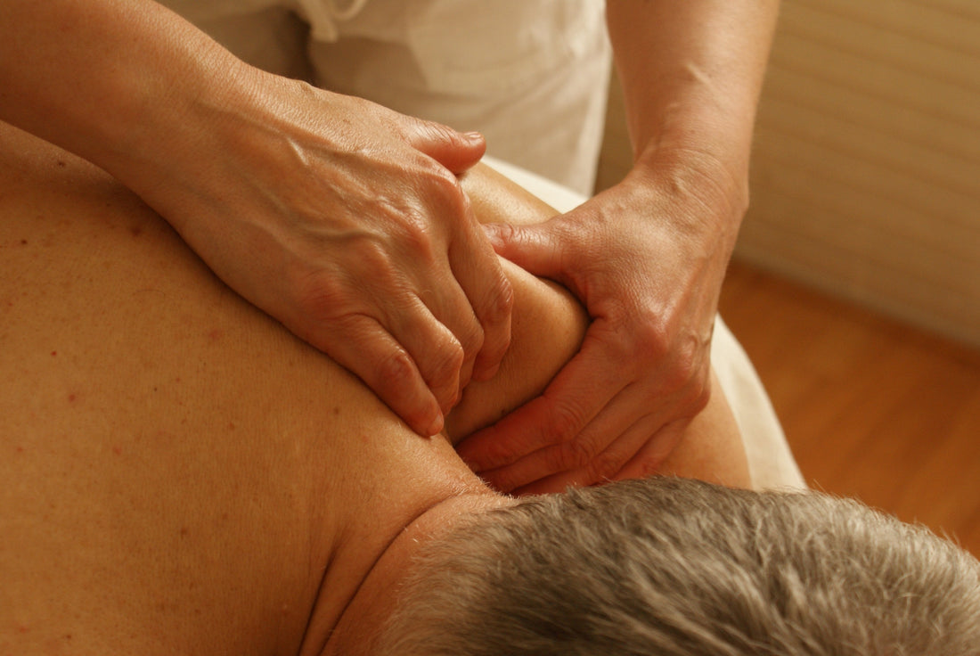 Rice Bran & Rosehip Massage Blend professional therapist performing deep muscle relief massage