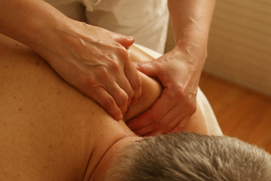 Rice Bran & Rosehip Massage Blend professional therapist performing deep muscle relief massage