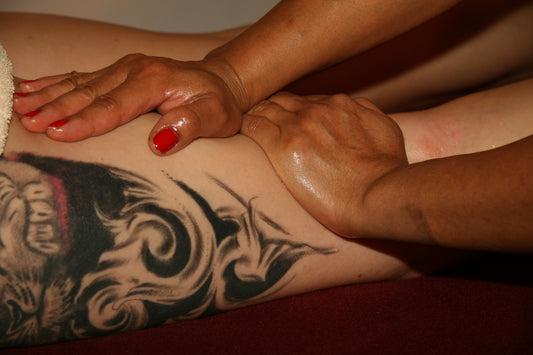 Body Oil for Mature Skin professional therapist applying oil massage for deep hydration