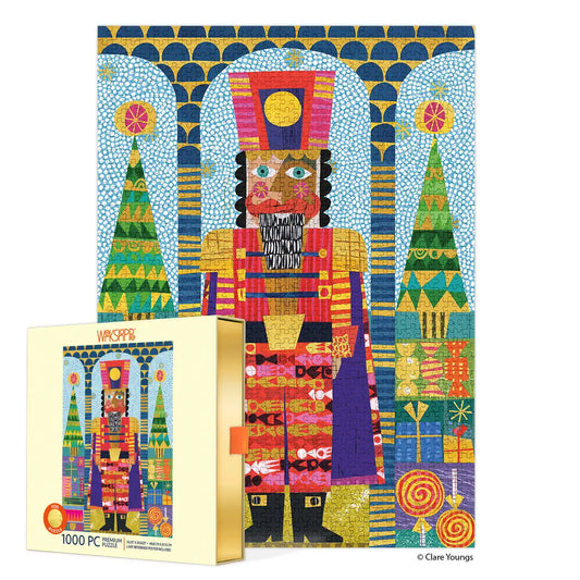 Colorful 1000-piece jigsaw puzzle featuring a folk-art nutcracker with gold foil accents and festive Christmas motifs.