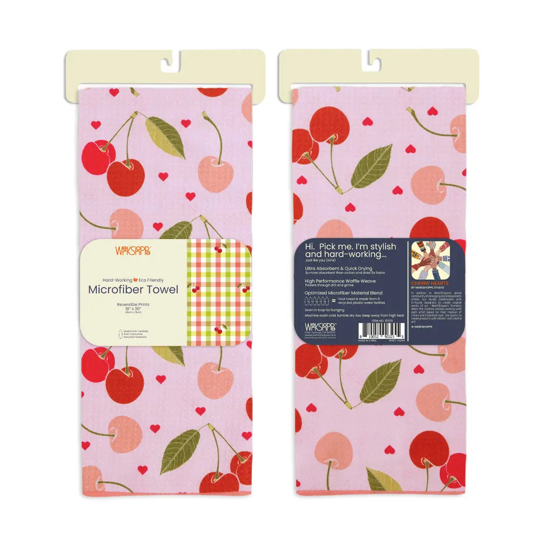 Pink microfiber kitchen towel with red cherry and heart pattern, featuring descriptive product packaging labels.